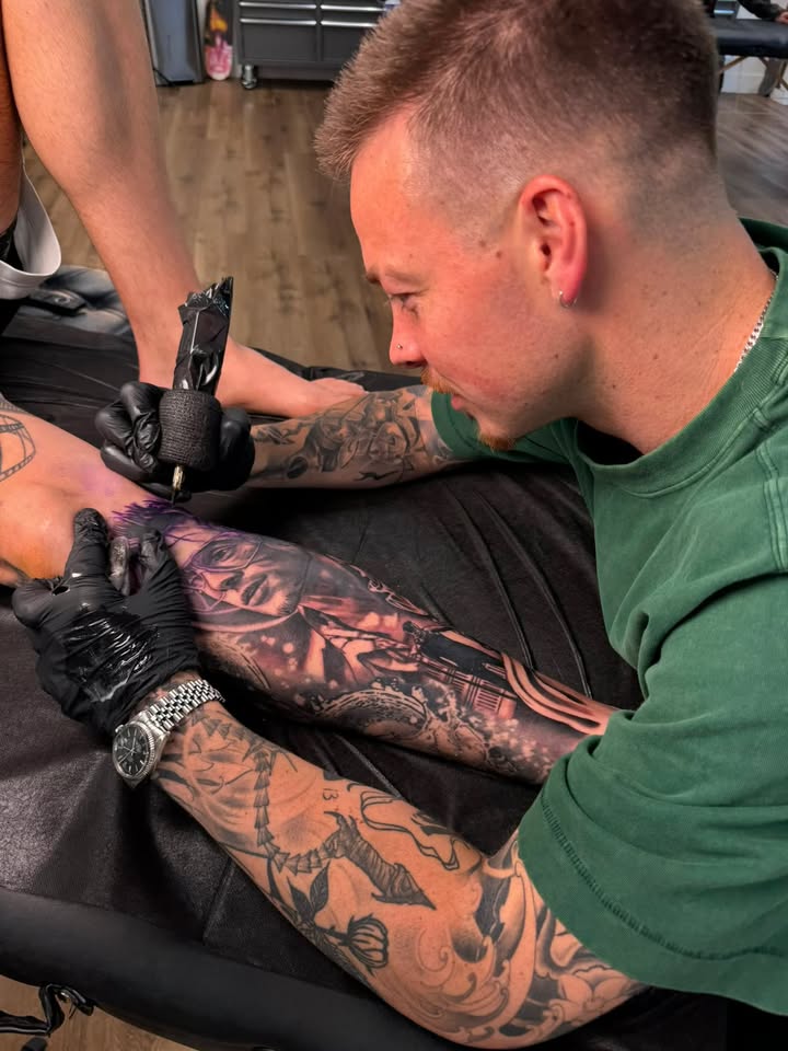 Trevor tattooing a portrait sleeve